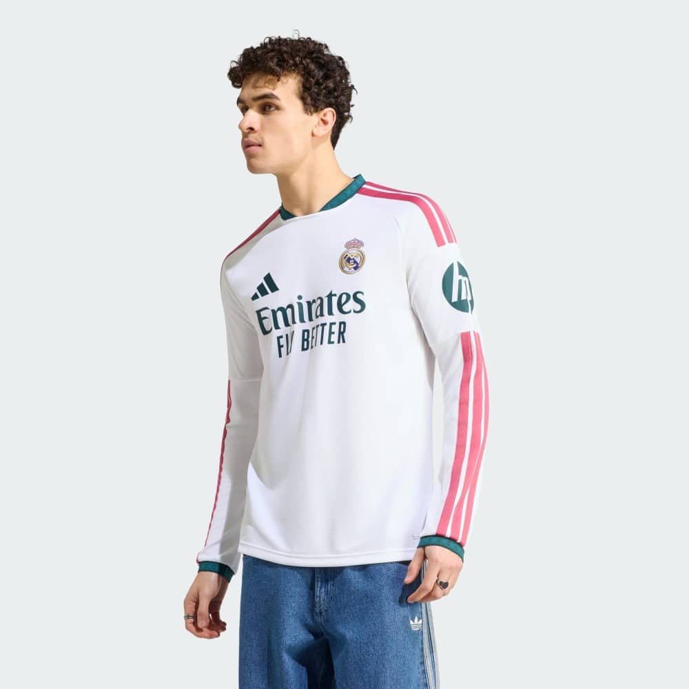 Camiseta Manga Larga Re. Madrid 2027 2 Camiseta manga larga Real Madrid 2027, primera equipación de adulto. Diseño exclusivo y tejido transpirable para aficionados.
