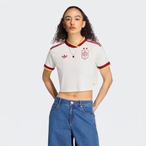 Equipación local de España para mujer, camiseta blanca con las dos estrellas de campeona del mundo.